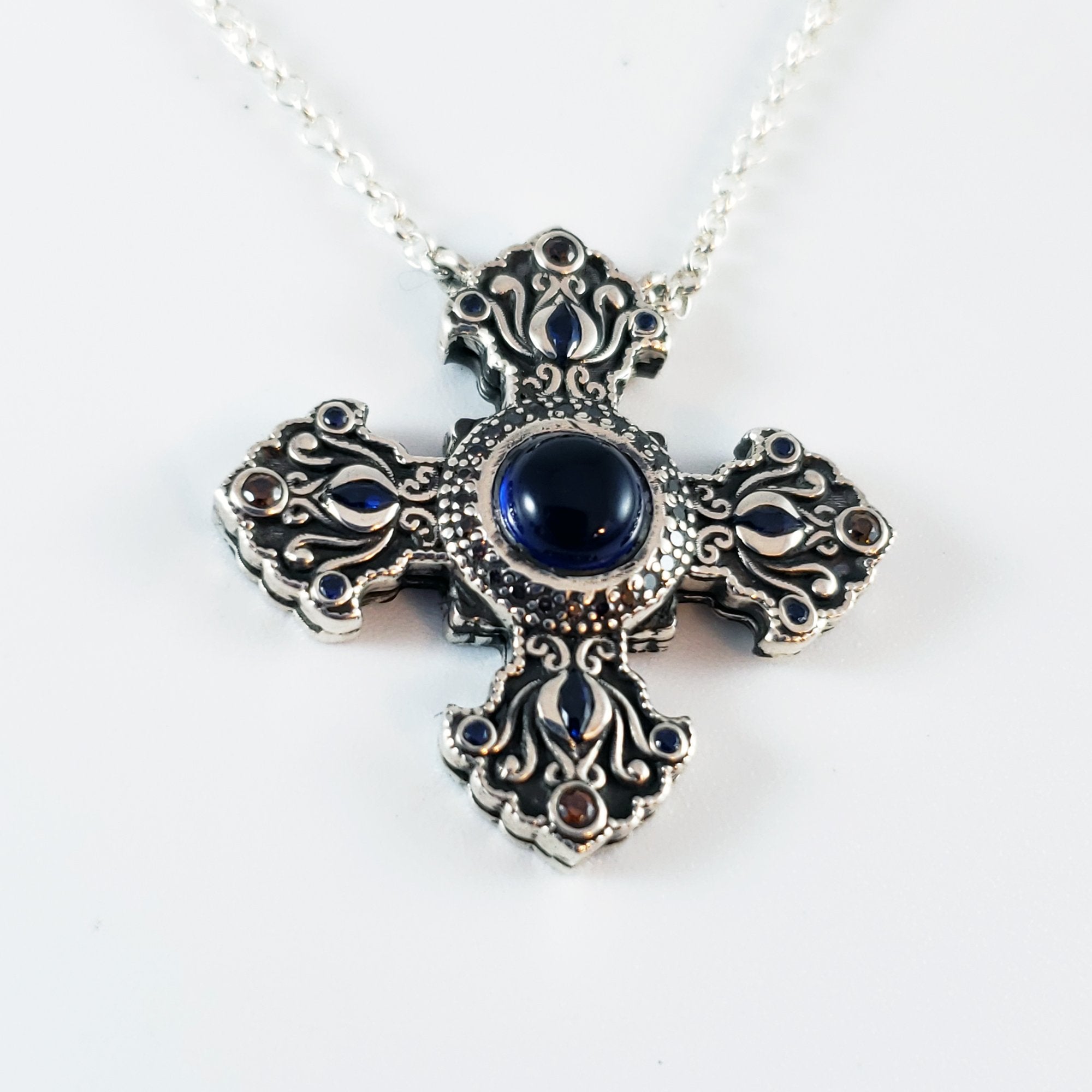 Arm Root Cross with Blue Corundum