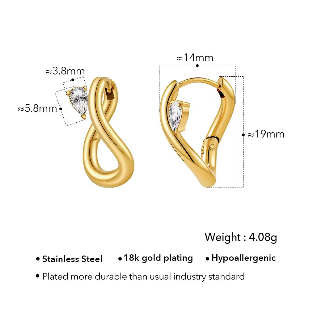 Abstract gold earrings with gem